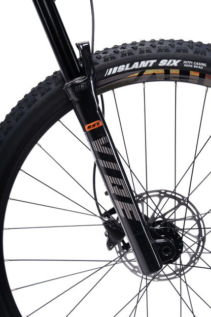 VRIDE Knight Pro full-suspension mountain bike with Shimano Deore gears, black frame, and knobby tires for off-road riding.