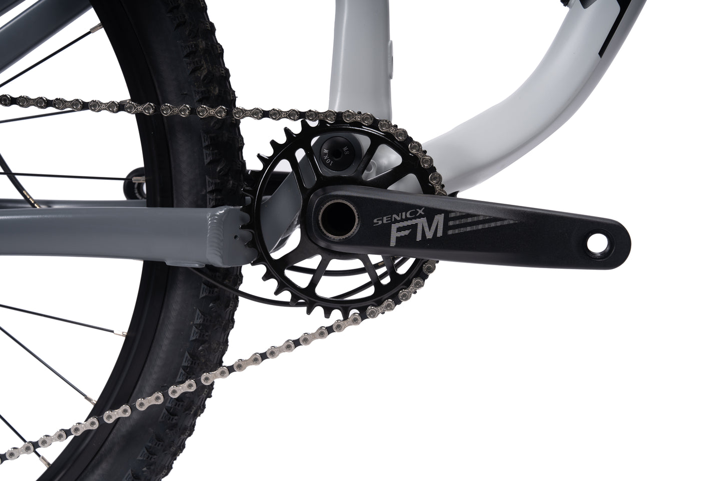 VRIDE Knight Pro full-suspension mountain bike with Shimano Deore gears, shown in a natural outdoor setting.