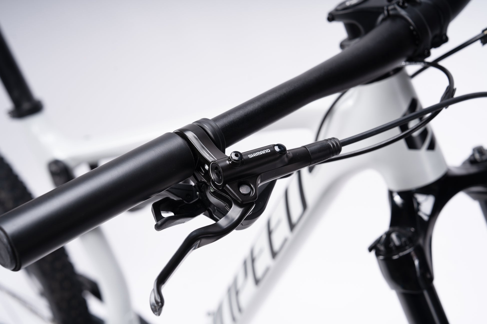 VRIDE Knight Pro full-suspension mountain bike with Shimano Deore gears, adult-sized frame, black and green design, ready for trail riding.