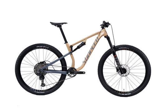 VRIDE Knight Pro full-suspension mountain bike with Shimano Deore gears, shown in a natural outdoor setting.