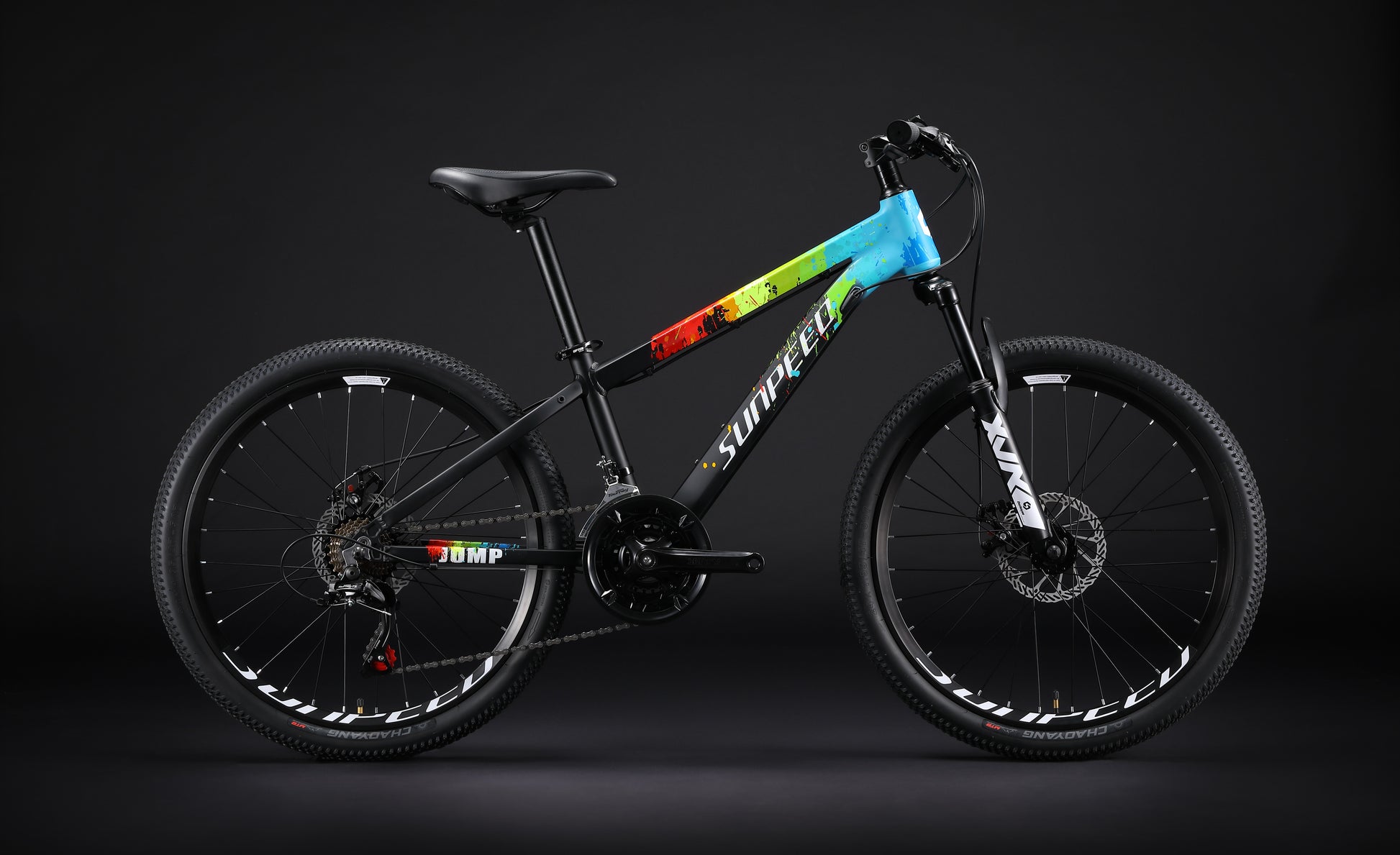 Black JUMP Kids' 24-inch mountain bike by VRIDE with Shimano Tourney gears, featuring a sturdy frame and knobby tires for outdoor riding.